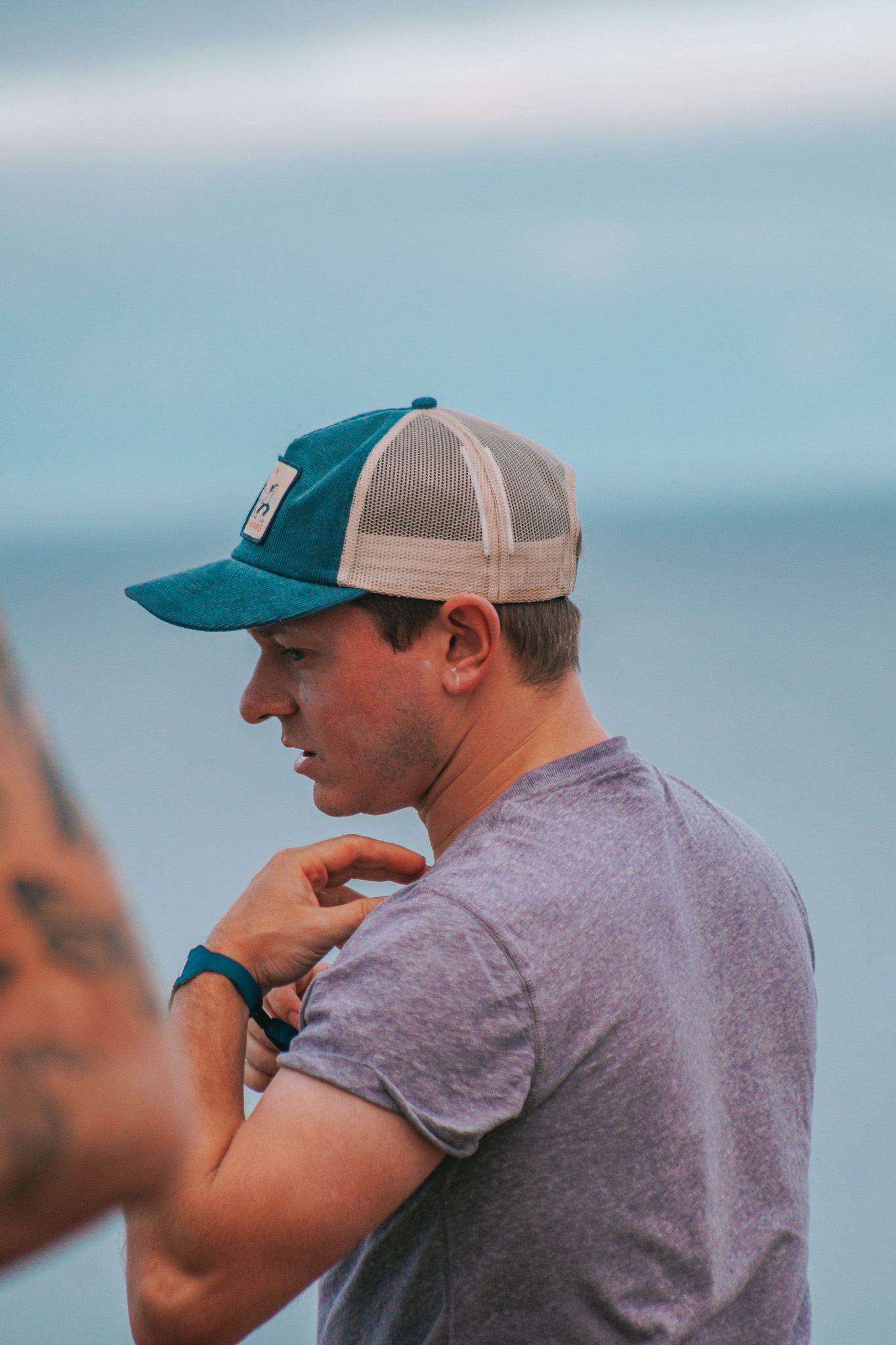 Marcus in a cap by the sea