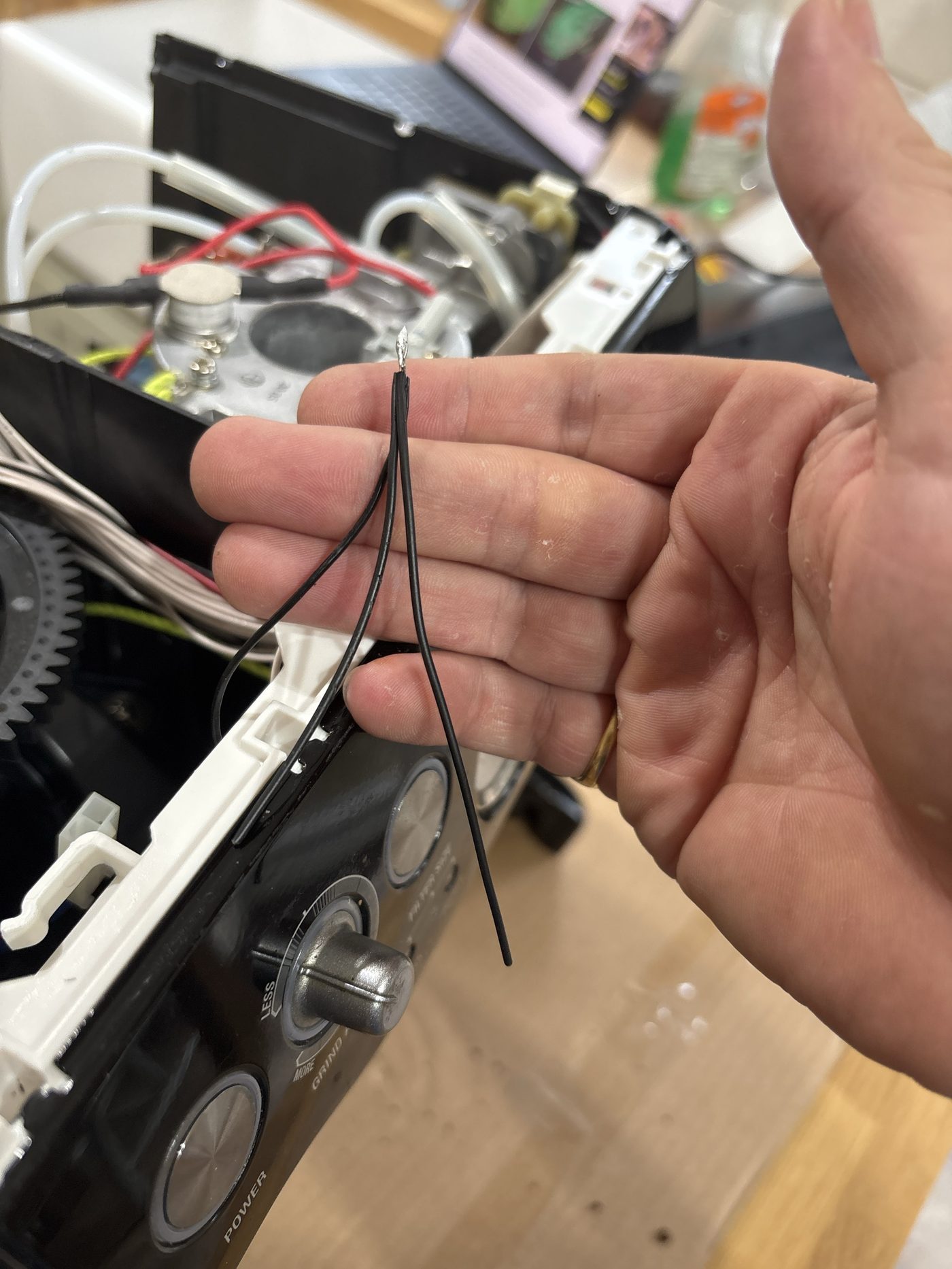 Three black wire ends twisted and soldered into one joint