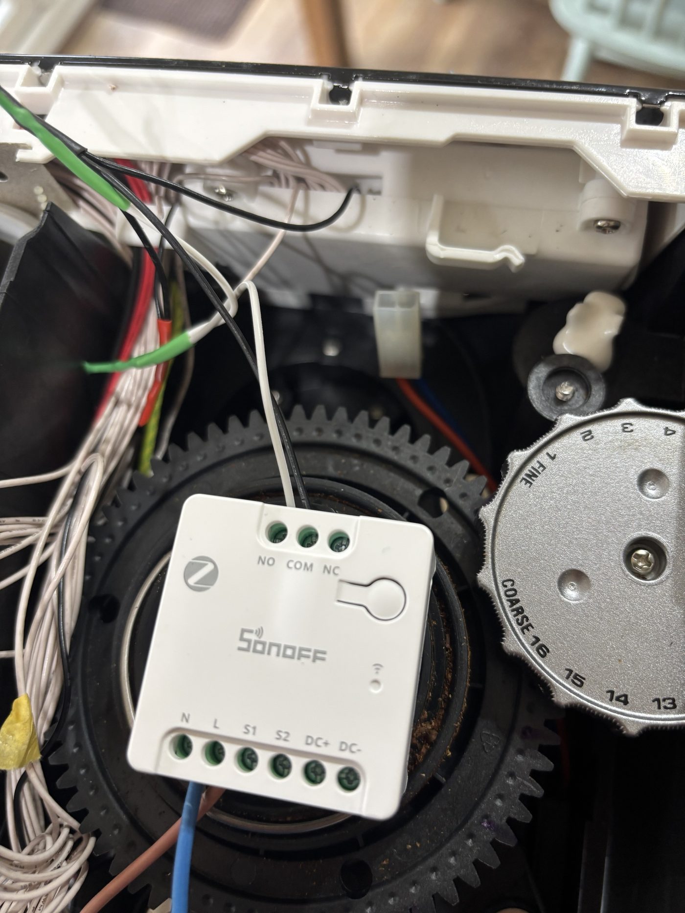 The relay with all four leads on: L, N, COM, NO